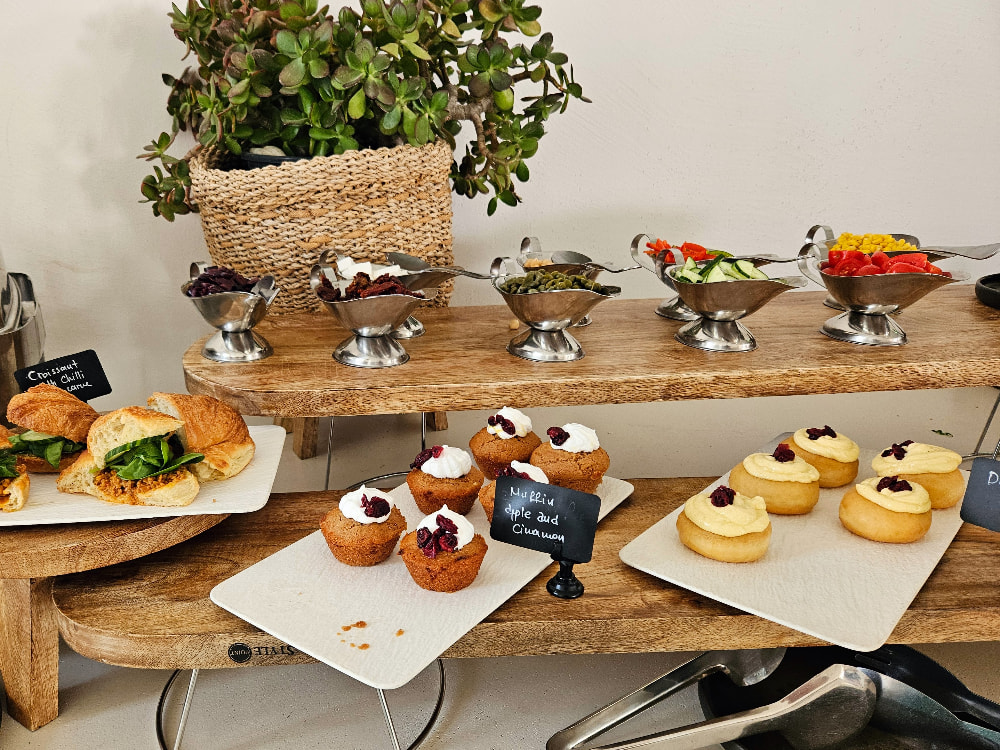 Breakfast buffet at Koukoumi, featuring vegan pastries