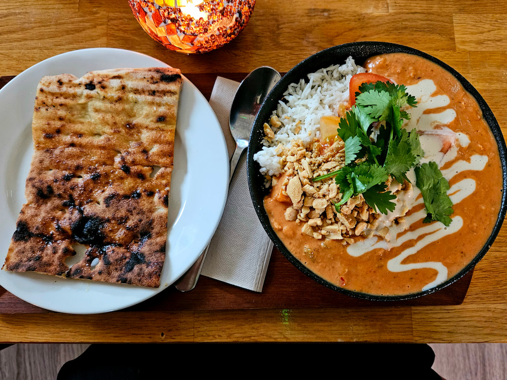 Vegan West African stew and garlic naan at Mama, vegan restaurant in Reykjavik, Iceland